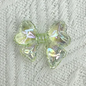 Green iridescent bow acrylic DIY charm, perfect for summer handmade bracelets and jewelry.
