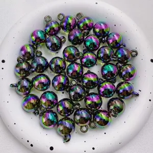 Close up detail of colorful rainbow UV plated acrylic round beads with hanging loops for DIY.