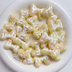 Acrylic bow beads with sweet icing drip design, perfect for cute DIY phone charms and accessories.