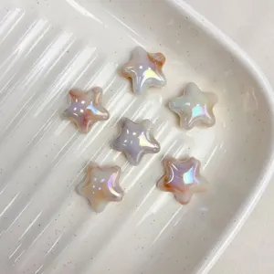 Close up of AB color gradient star beads for DIY jewelry making, bracelets, and hair accessories.
