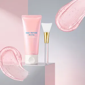Detail shot showing the pink peptide night wrapping mask tube and brush set with gel texture.