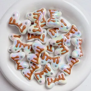 Acrylic macaron color bow beads detail close-up, cute DIY charm for phone strap and keychain making.