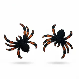 Detailed close-up of embroidered spider patches featuring vibrant black and orange tarantula designs.