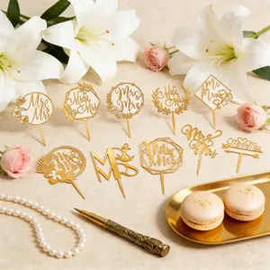 Gold acrylic wedding cake toppers, elegant Mr and Mrs cake picks for engagement party decor.