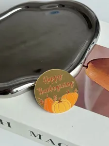 Thanksgiving acrylic cupcake topper with cute pumpkin print, detail shot for party decor.