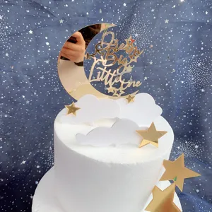 Gold mirror acrylic moon cloud star cake topper detail, dream big little one quote design.