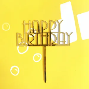 Gold acrylic Happy Birthday cake topper detail showing reflective surface and clean cutout design.