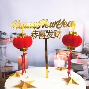Gold acrylic Happy New Year cake topper with red lanterns for festive party decoration
