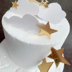 Gold star and white cloud acrylic cake topper set details, perfect for birthday party decor.