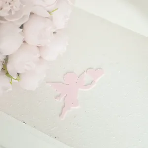 Pink cupid heart cake topper detail shot, perfect for Valentine's Day baking decoration ideas.