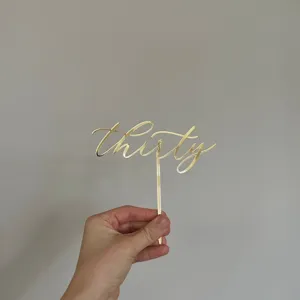 Gold acrylic thirty cake topper for 30th birthday party and anniversary celebrations decor.
