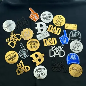 Father's day acrylic cake topper detail, gold silver black blue inserts with dad text style.