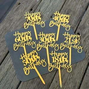 Gold acrylic happy birthday cake topper set with various numbers for party decoration.