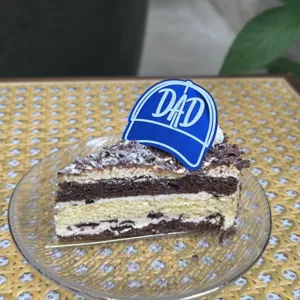 Father's day cake topper blue dad hat decoration for cupcakes and party desserts detail view.