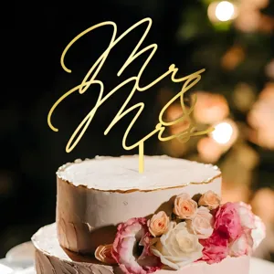 Gold acrylic Mr & Mrs wedding cake topper detail view for romantic celebration party decor.