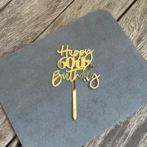 Gold acrylic 60th birthday cake topper detail, elegant glitter party dessert decoration.