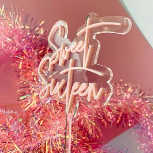 Acrylic Sweet Sixteen cake topper detail, pink layered birthday party cake decoration