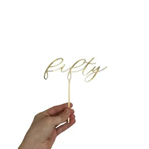 Gold acrylic fifty cake topper for birthday party and anniversary celebration main view.