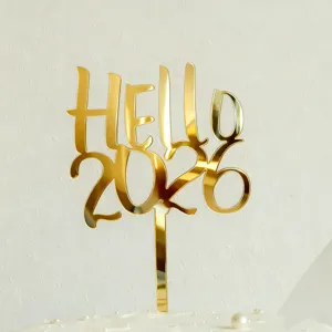 Gold acrylic cake topper featuring stylish hello 2026 text for new year party decoration details.