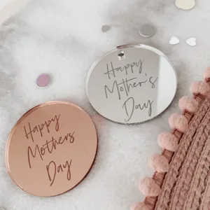 Acrylic Mother's Day cake decoration detail shot showing shiny mirror finish charms.