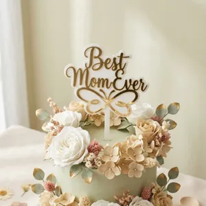 Mother's Day acrylic cake topper detail, best mom ever gold lettering with butterfly design.
