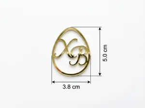 Ciondolo per torta uovo di Pasqua in acrilico dorato con intaglio XB, 3.8x5.0 cm.