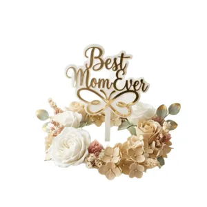 Mother's day cake topper with floral wreath and acrylic Best Mom Ever sign for party.