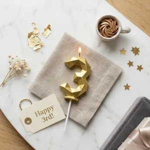 Gold geometric number 3 birthday candle, exquisite cake decoration for party celebration.