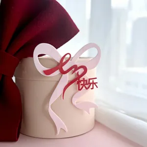 Acrylic cake topper with bow design, perfect for Valentine's Day, parties and celebrations.
