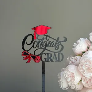 Acrylic graduation cake topper with Congrats Grad design, perfect for party celebration.