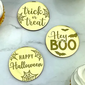 Gold acrylic Halloween cupcake toppers detail showcasing spooky engraved text for party decor.