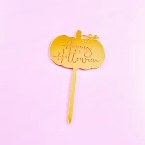 Gold acrylic pumpkin cake topper detail view, Halloween party decoration close up accessory