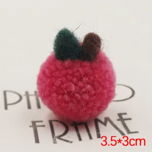 Handmade plush apple pompom detail, cute fluffy DIY accessory for phone cases and brooches.