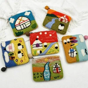 Handmade wool felt coin purse detail, cute cartoon sheep yurt design zipper pouch.