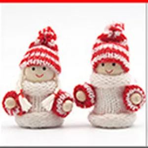 Cute Christmas knitted dolls with red and white hats and scarves for festive holiday home decor.