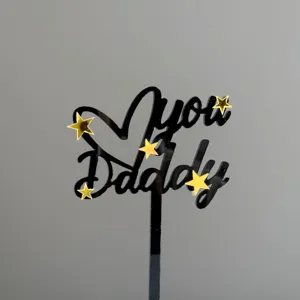 Black acrylic Father's Day cake topper with gold stars, perfect for party cupcake decoration.