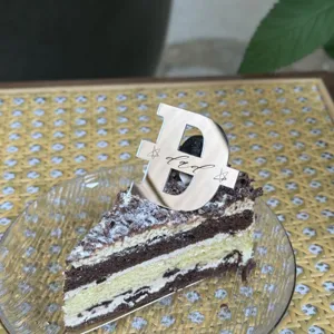 Father's Day silver letter D cake topper detail view showcasing elegant mirror finish design.