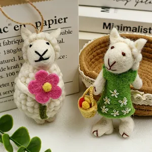 Handmade wool felt sheep keychain and cute animal pendant for creative gift and home decor.