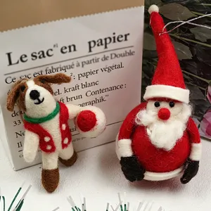 Handmade wool felt Santa Claus and dog Christmas tree hanging ornaments for holiday decor.