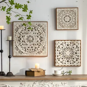 Detailed view of rustic wooden carved wall panels hanging in an elegant home interior setting.