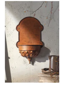 Close-up detail of vintage style iron wall planter, retro antique copper finish texture.