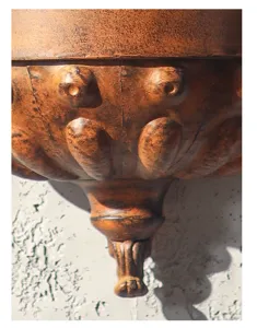 Detailed view of European retro iron wall planter, antique metal relief craft decor.