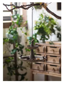 Vintage industrial style hanging bird feeder for outdoor garden, rustic metal bird bath.