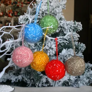 Handmade wool yarn ball detail shot, perfect for Christmas tree decor, winter holiday craft display.