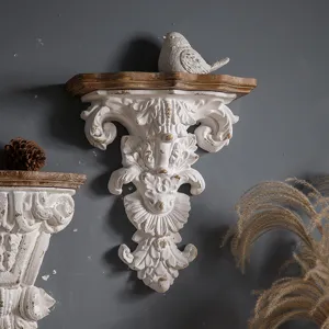 French vintage style decorative wall shelf with carved floral relief and bird decor.