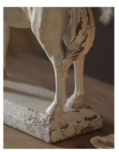 Detailed close-up of a distressed vintage resin horse sculpture base, wabi-sabi style.