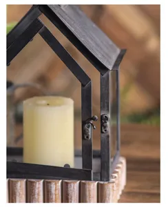 Close-up detail of vintage iron glass house candle lantern rustic home decor display ornament