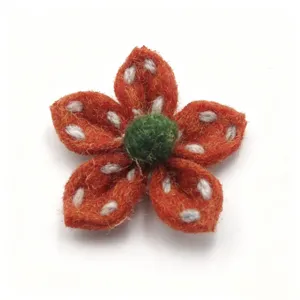 Handcrafted felt five-petal flower puff flower accessory detail for clothing and bags.