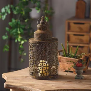 Vintage iron candle lantern holder with hollow-out pattern for garden home decor.
