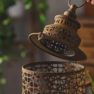 Vintage iron candle holder decorative hanging lantern for rustic garden and home interior decor.